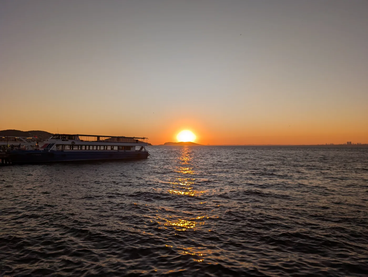 Golden hour sunset over Büyükada historic passenger ferry terminal